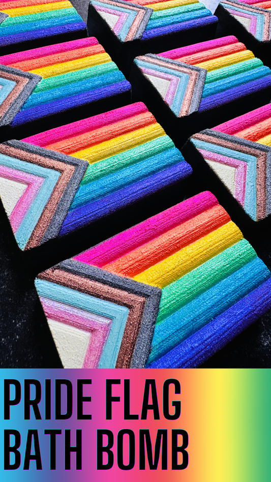 Colorful bath bomb with rainbow pattern and text 'Pride Flag Bath Bomb' on a black background